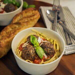 A bowl of spaghetti and venison meatballs.