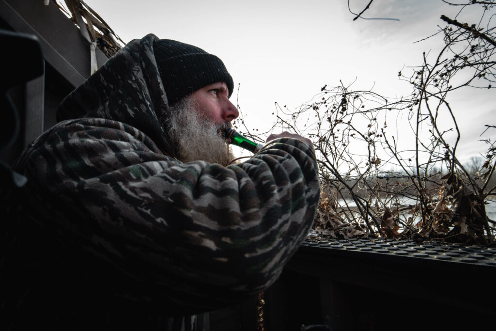 Billy Campbell working a duck call.