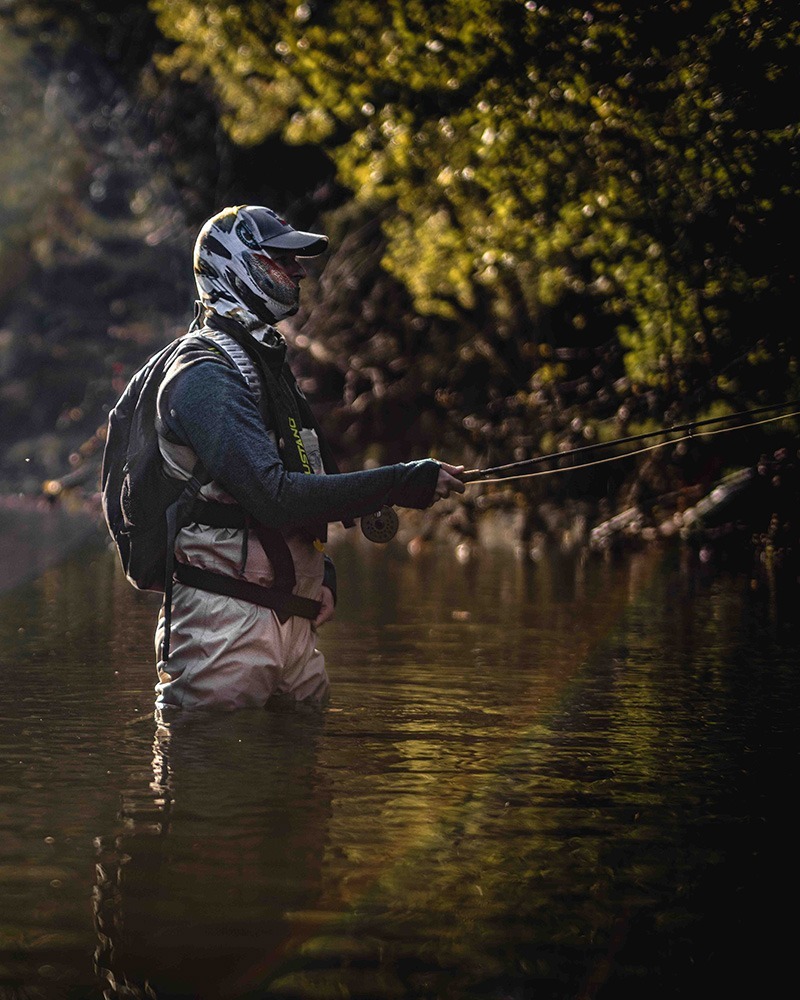 Woman fly fishing