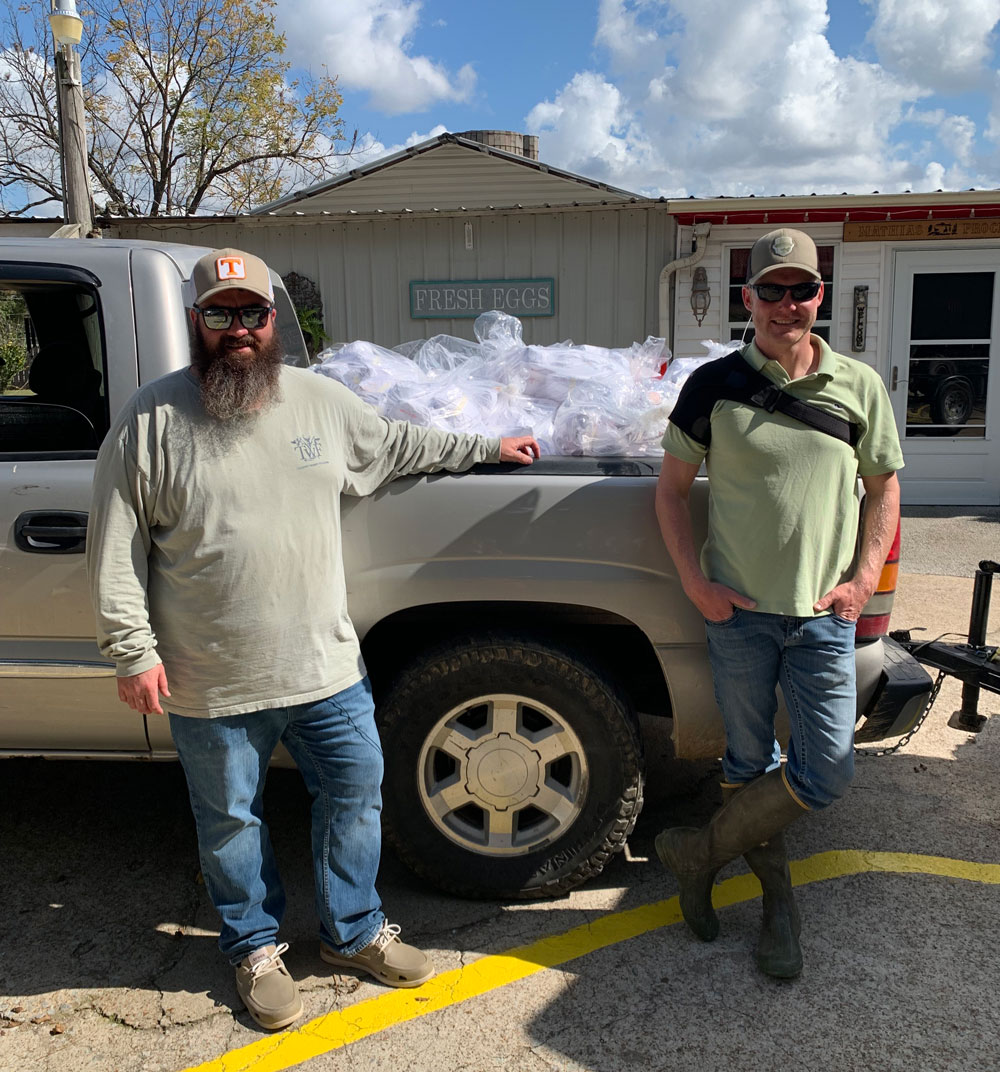Matt Simcox (left) delivered donated venison to those affected by the tornado this week.