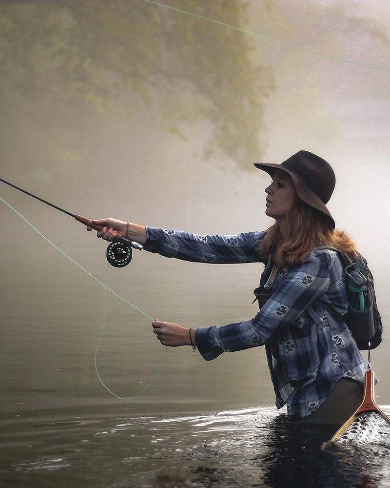 Woman fly fishing