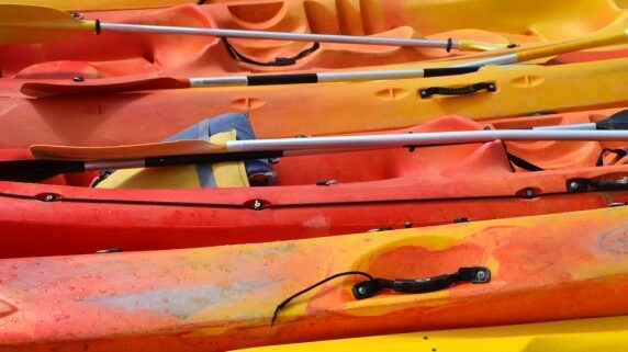 A closeup of worn kayaks