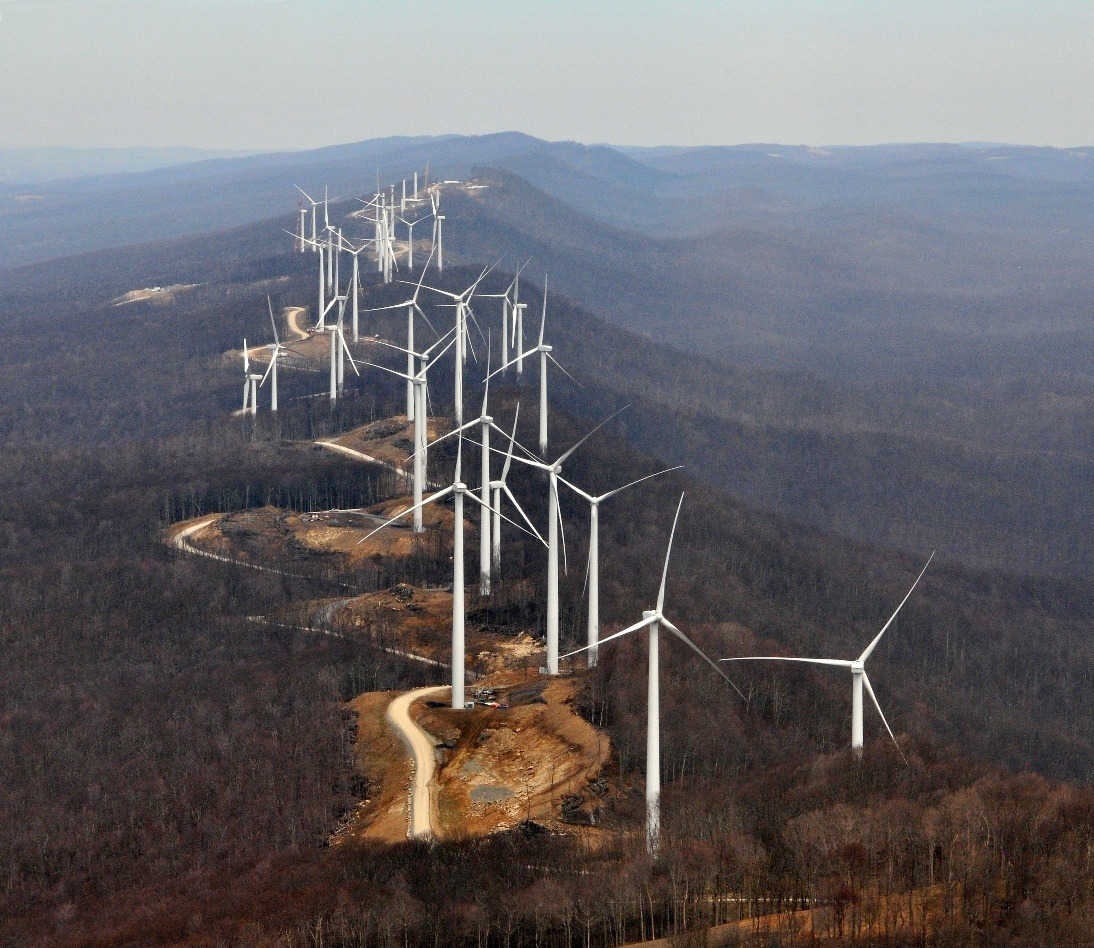 Wind turbines along a mountain ridge.