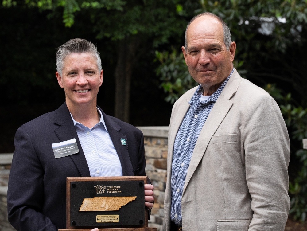 State Forester Heather Slayton and Commissioner Charlie Hatcher, accepting the 2025 Forest Conservationist of the Year Award on behalf of the Tennessee Department of Agriculture's Division of Forestry